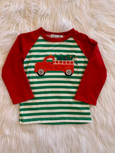 Red truck with Christmas tree